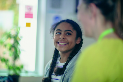 girl talking to an adult
