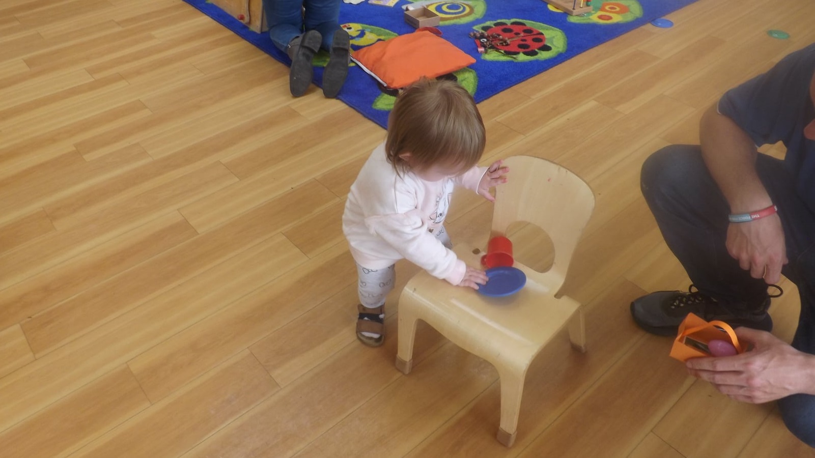 Baby playing with a chair